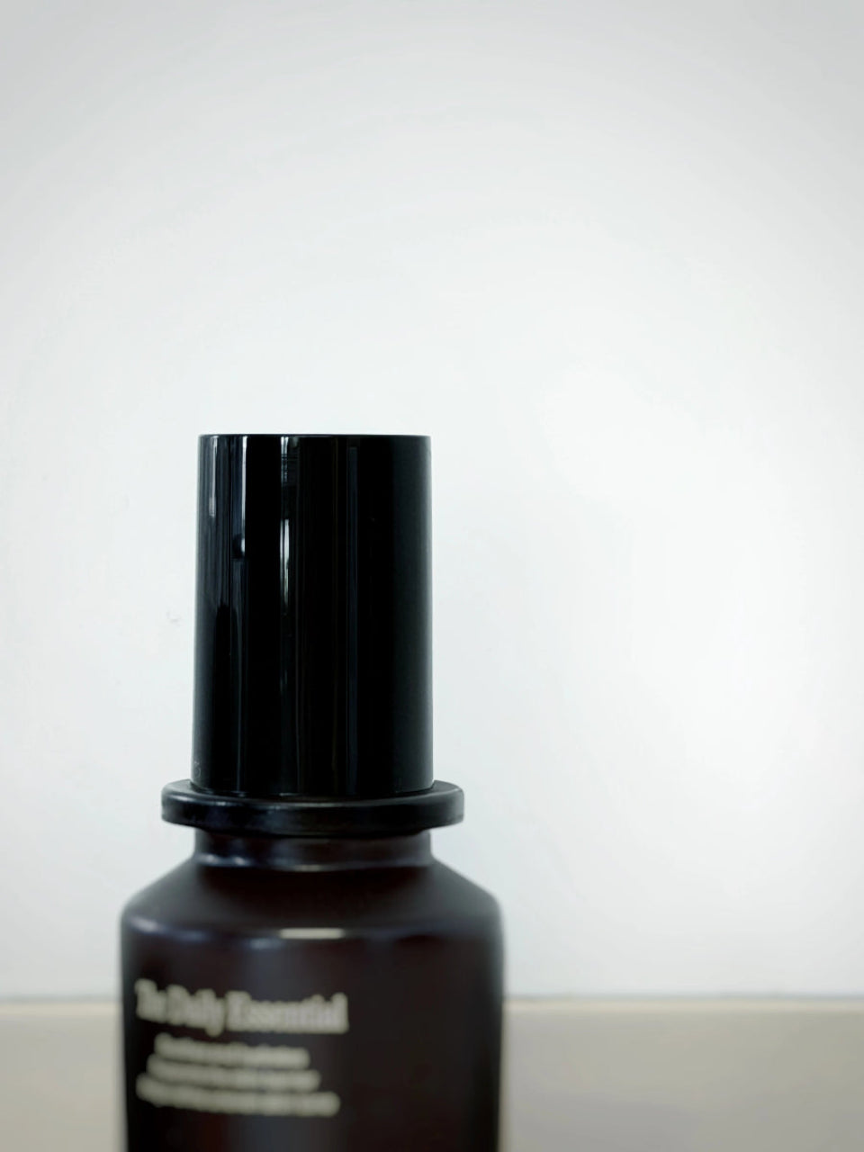 The Daily Essential moisturiser — 50ml pump bottle on stone surface — The Prepared Guy